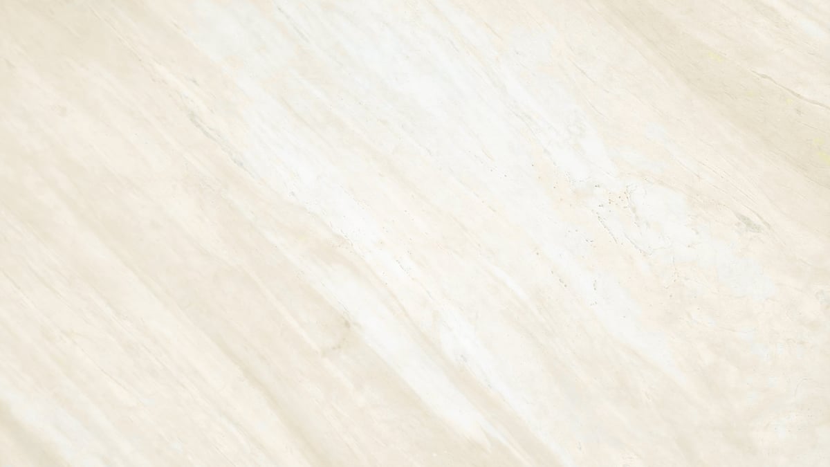 Smooth cream and gold marble surface with delicate flowing veins